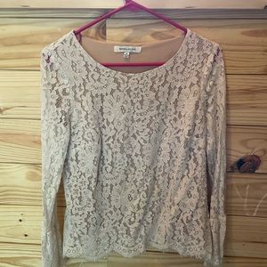 Cream lace long sleeve top with sheer lace sleeves.